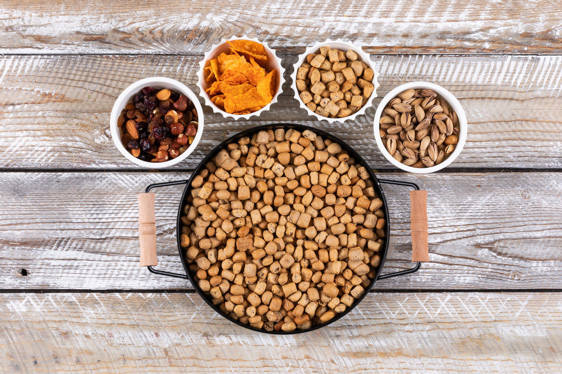 Pet food and various grains in separate bowls